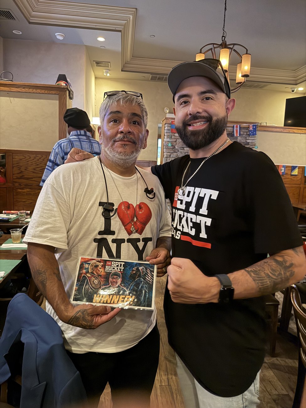 Buckethead member Mike Ramirez with JJ Salomon, holding his Zayas vs Ennis giveaway prize